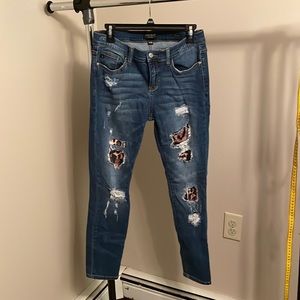 Size 11 Judy blue distressed with leopard print jeans.